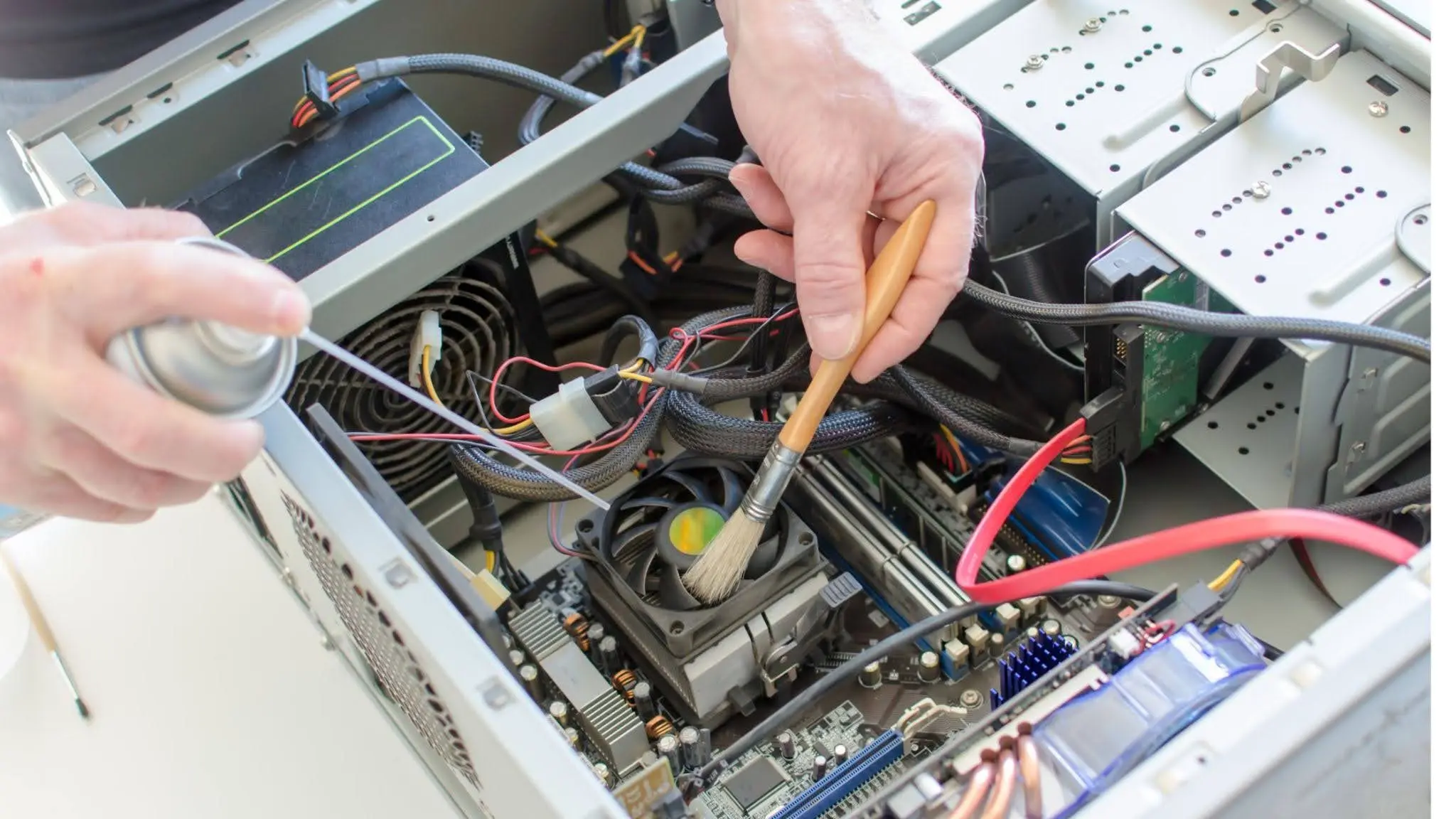 Technician performing pc repair diagnosis on an open desktop